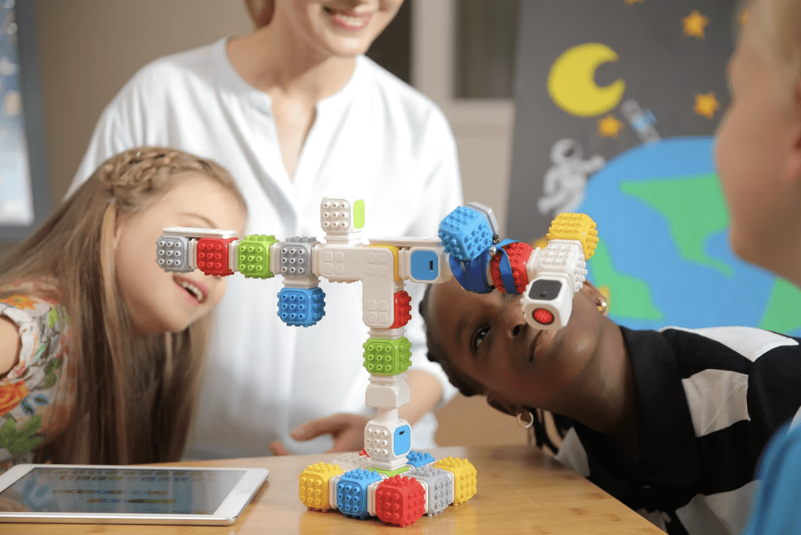 Child assembling a Cubroid robot