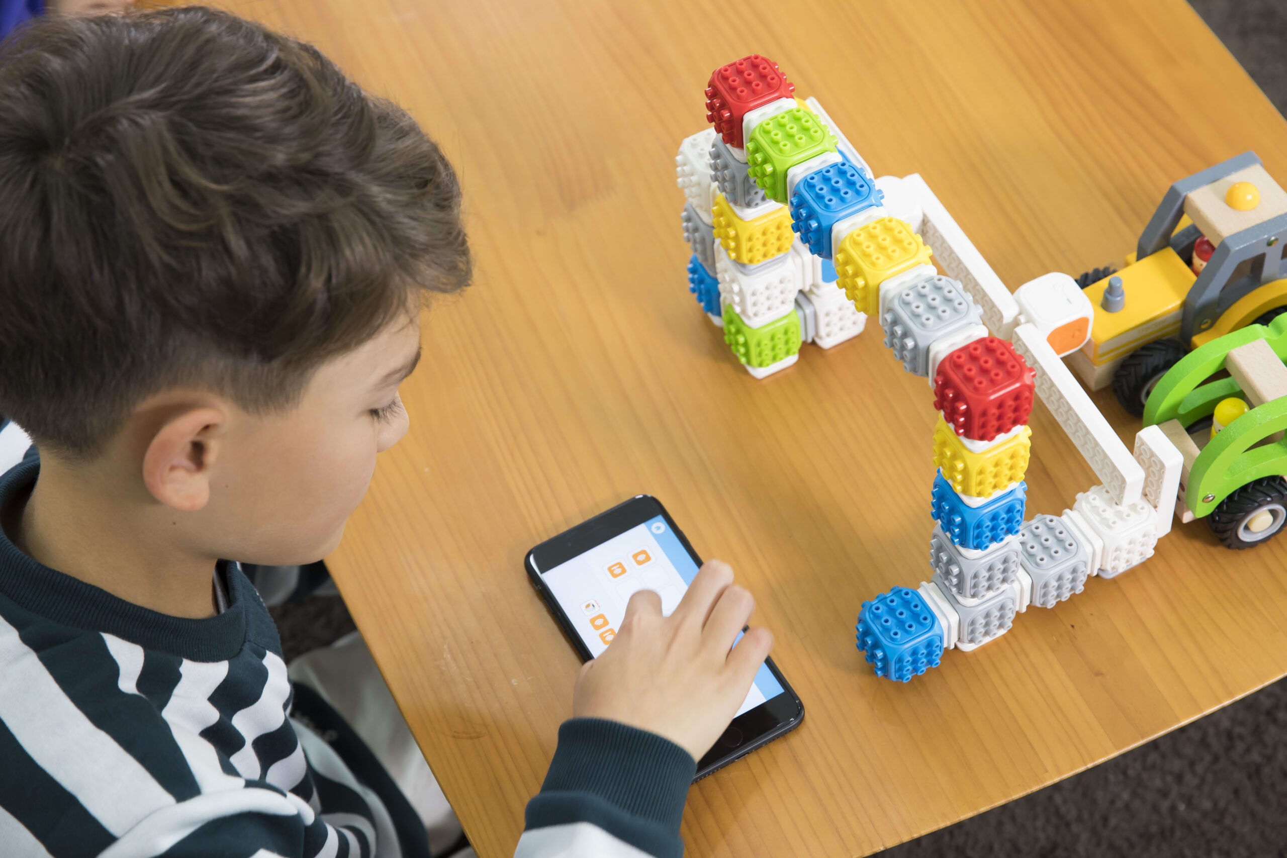 Learners smiling with robotics kit